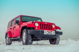 Red Suv on Snow Covered Grounds | Breast Cancer Car Donations