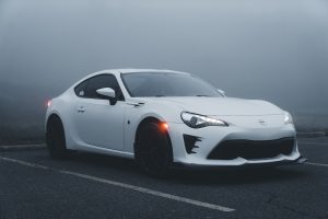 White Toyota GT86 on a Parking Lot in Fog | Breast Cancer Car Donations